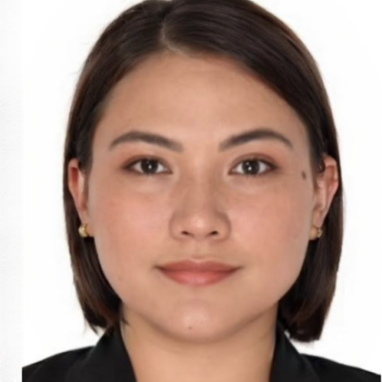 Dr. April Uba smiles at the camera. She has sort dark hair.